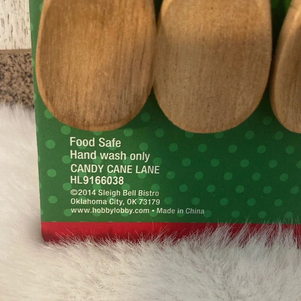 Sleigh Bell Bistro Wooden Spoons with Red Swirl Handles